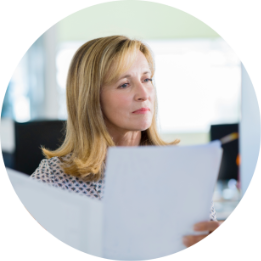 Woman holding documents.